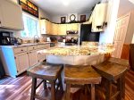 Charming Kitchen with Island Seating that is fully equipped for all your cooking needs 